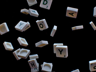 Scrabble letters flying in the air