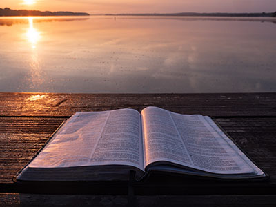 Open Bible on a dock