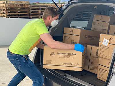A man loading boxes into a van